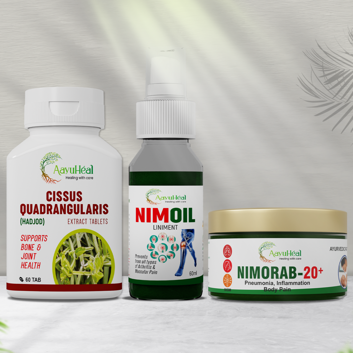 Three Ayuh heal natural remedies from Cissus Quadrangularis, Nimoil, and Nimorab-20+ displayed side by side on a light gray background with soft leaf shadows.